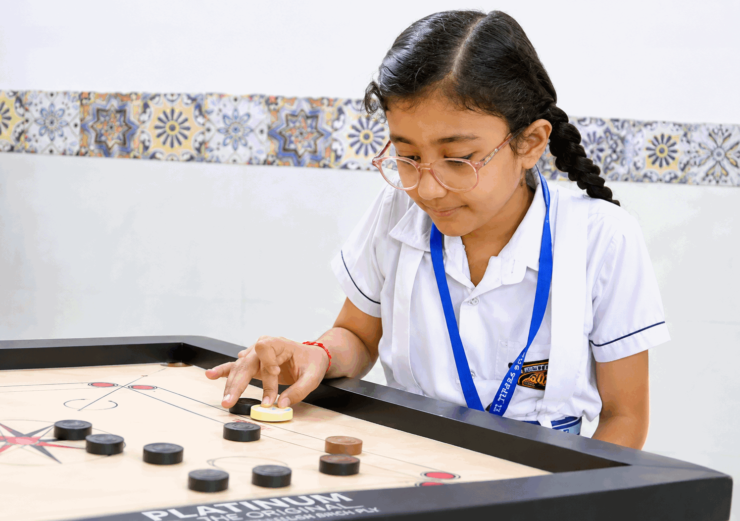 Student playing carrom